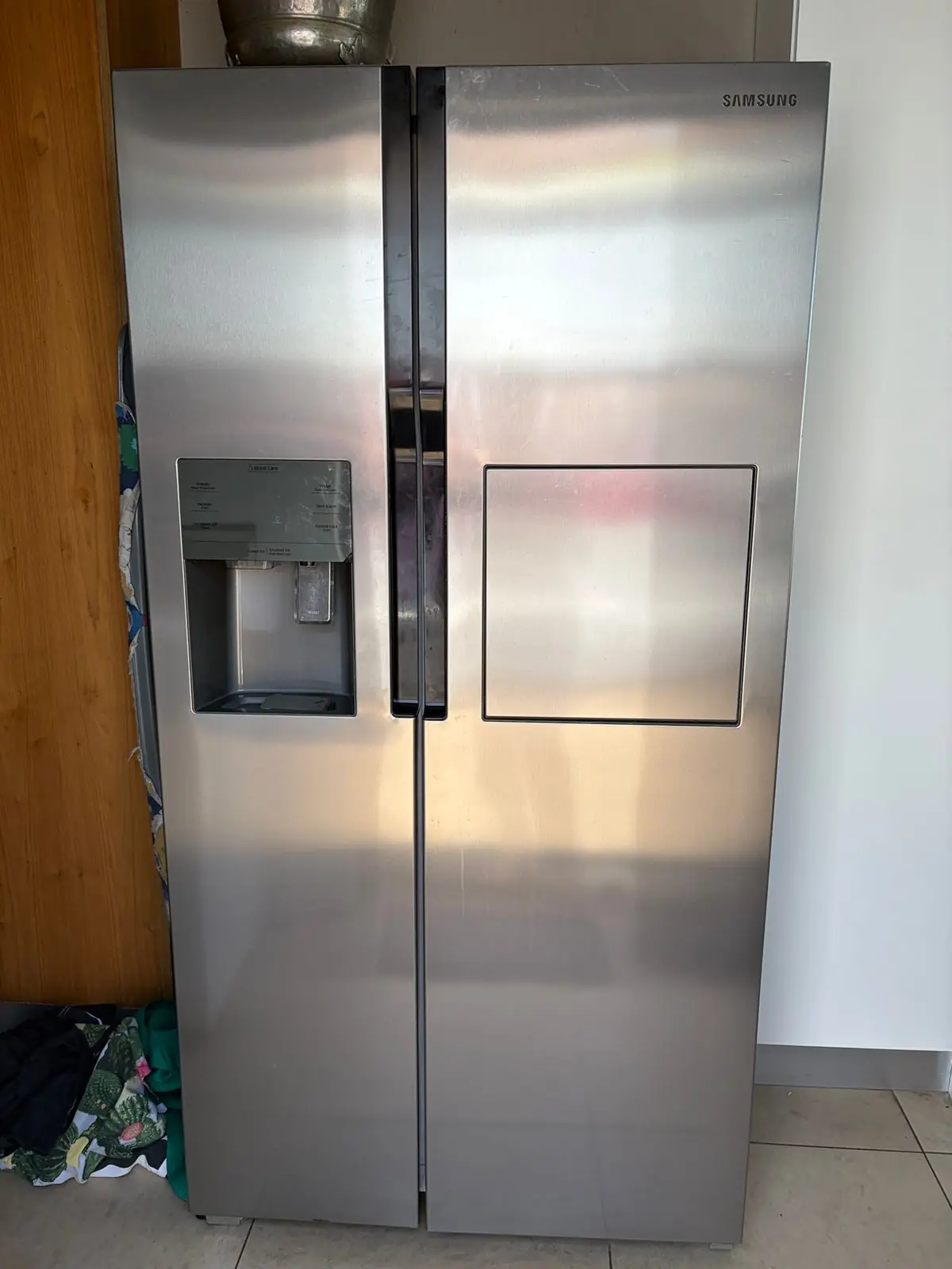 Stainless-steel side-by-side fridge after repair assessment
